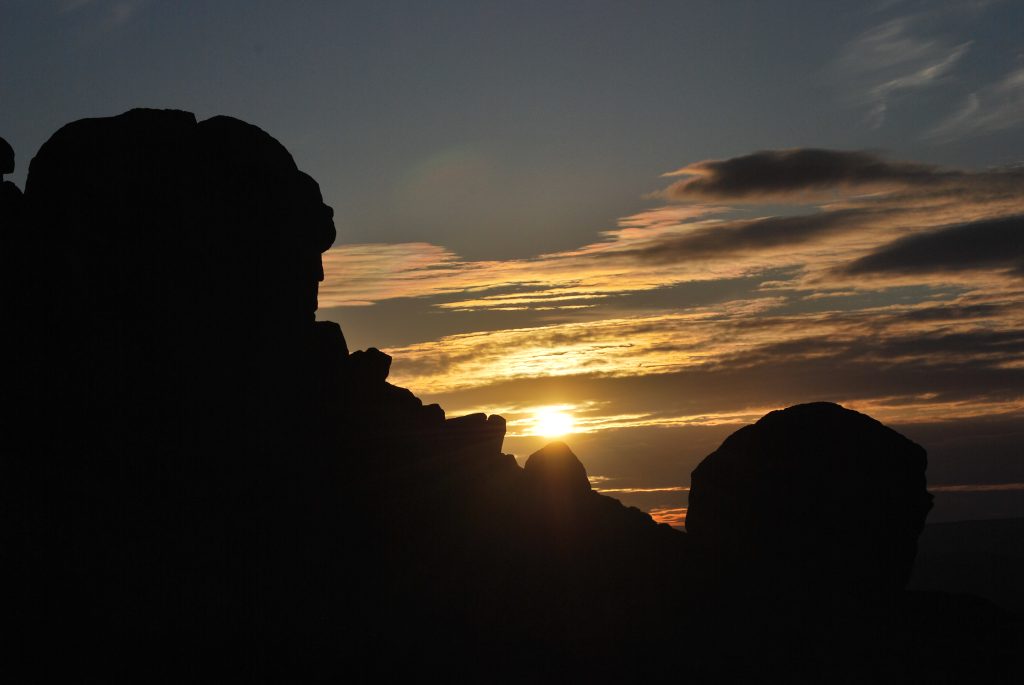 The Cow and Calf rocks on Ilkley Moor silhouetted against a summer sunset