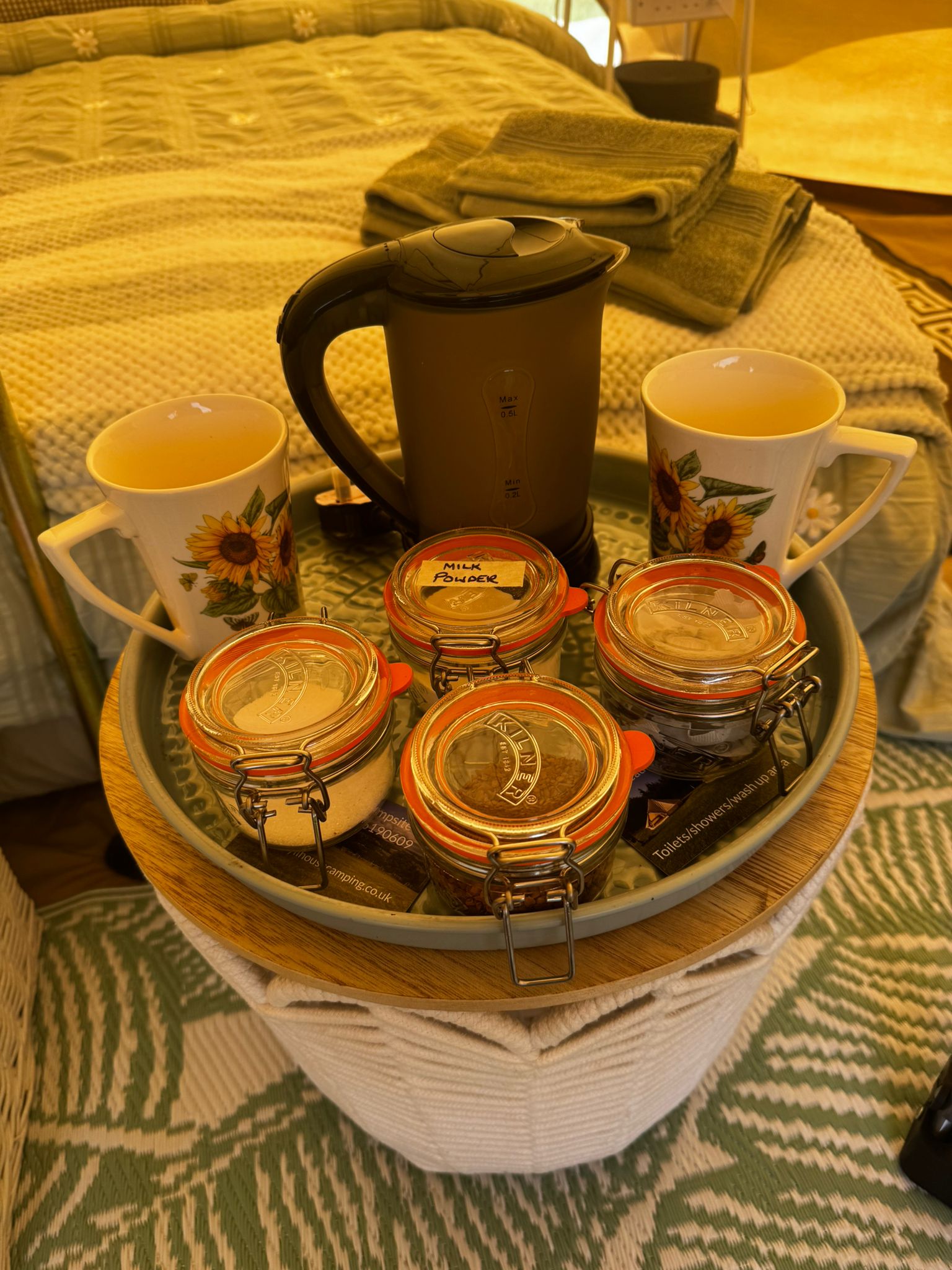 Welcome tea tray with kettle, mugs and Kilner jars in the couples glamping teepee at Ghyll House Campsite