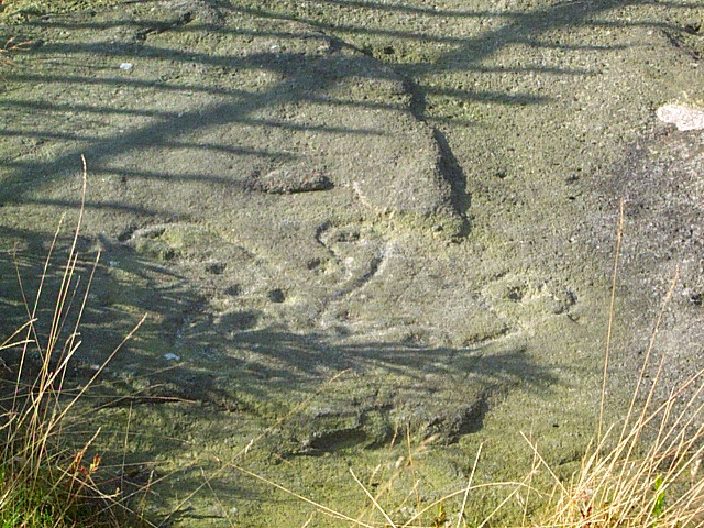 Close-up detail of the carved Swastika Stone on Ilkley Moor