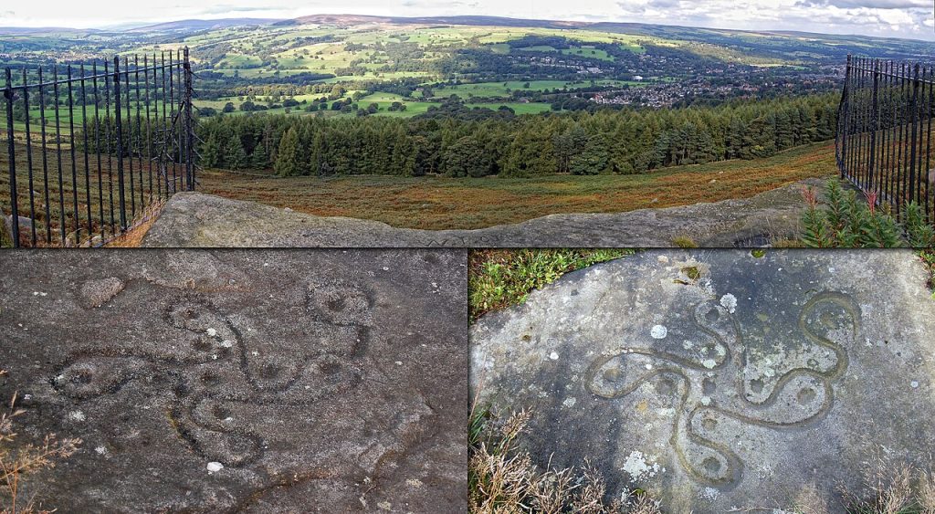 The Swastika Stone on Woodhouse Crag, Ilkley Moor, surrounded by iron railings
