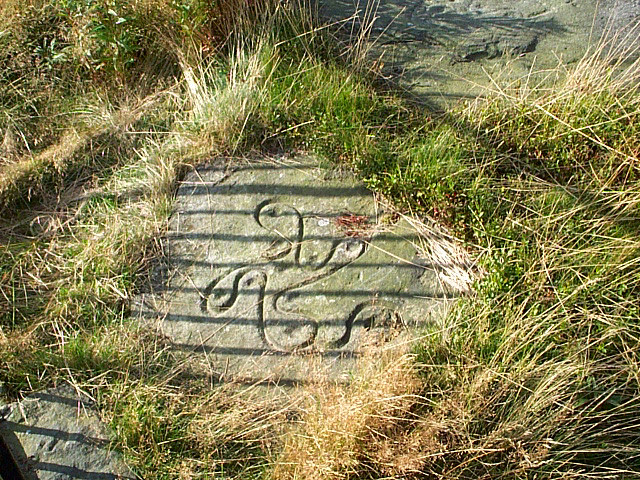 The clearer Victorian replica of the Swastika Stone carving